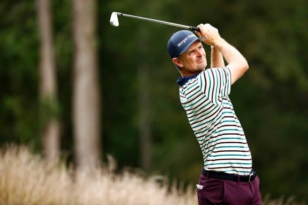 Justin Rose of England plays his shot from the 12th tee during the third round of the Wyndham Championship at Sedgefield Country Club on August 14,...