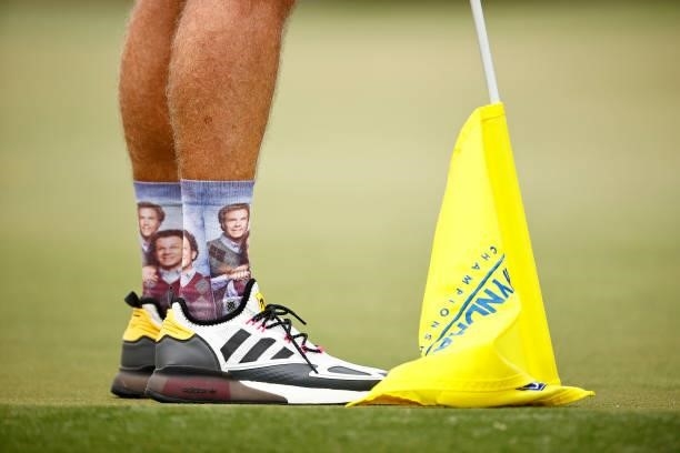 Detailed view of socks worn by Mike Bestor, caddie to Kevin Streelman , during the third round of the Wyndham Championship at Sedgefield Country Club...