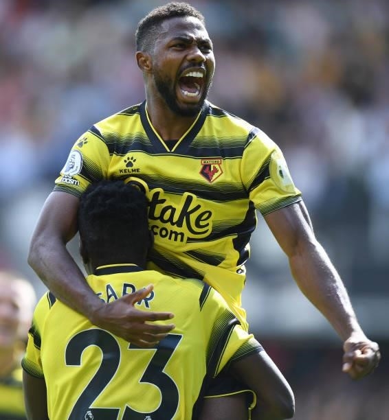Emmanuel Dennis of Watford celebrates scoring their first goal during the Premier League match between Watford and Aston Villa at Vicarage Road on...