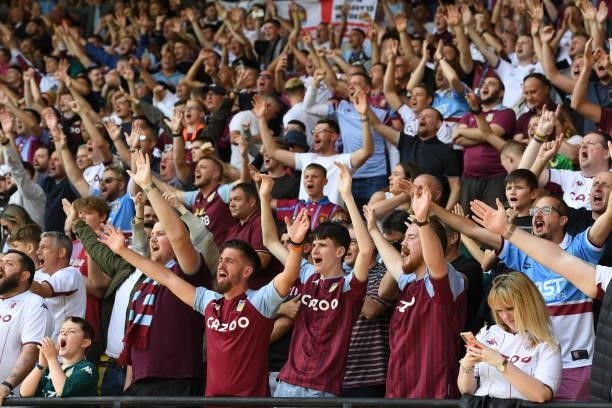 Fans of Aston Villa show their support for their team during the Premier League match between Watford and Aston Villa at Vicarage Road on August 14,...