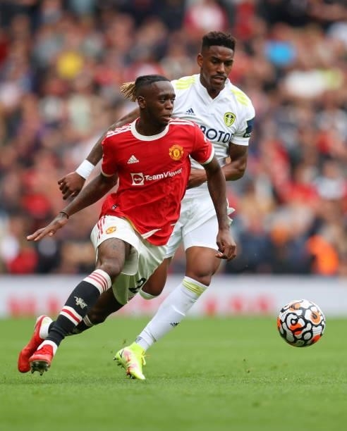 Aaron Wan-Bissaka of Manchester United competes with Junior Firpo of Leeds United during the Premier League match between Manchester United and Leeds...