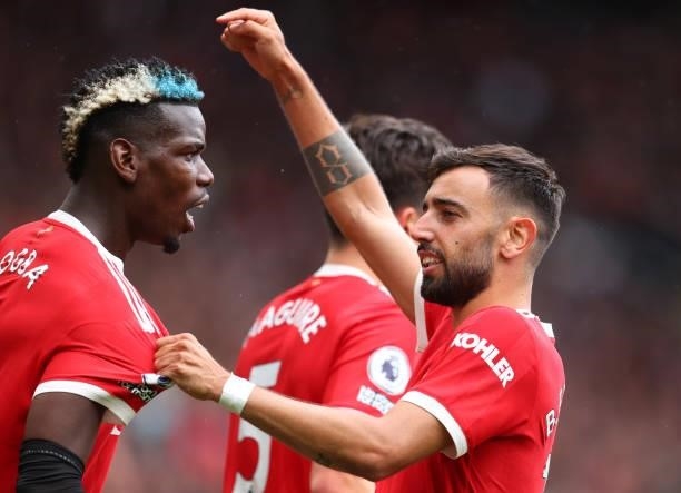 Bruno Fernandes of Manchester United points to Paul Pogba during the Premier League match between Manchester United and Leeds United at Old Trafford...
