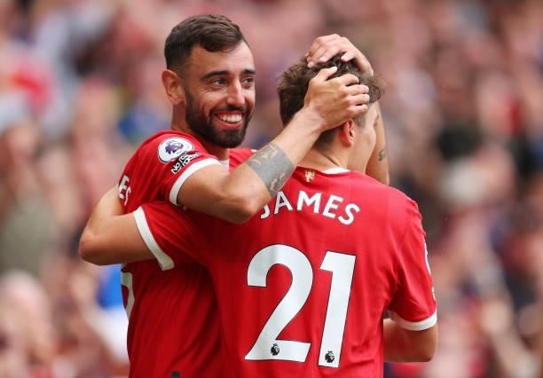 Bruno Fernandes of Manchester United celebrates with Dan James during the Premier League match between Manchester United and Leeds United at Old...