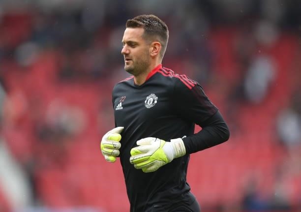 Tom Heaton of Manchester United warms up ahead of the Premier League match between Manchester United and Leeds United at Old Trafford on August 14,...