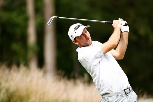 Russell Henley of the United States plays his shot from the 12th tee during the third round of the Wyndham Championship at Sedgefield Country Club on...