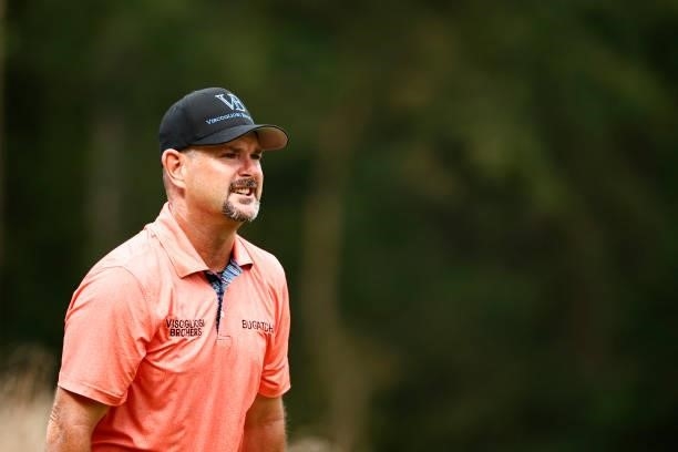 Rory Sabbatini of Slovakia reacts to his shot on the 12th tee during the third round of the Wyndham Championship at Sedgefield Country Club on August...