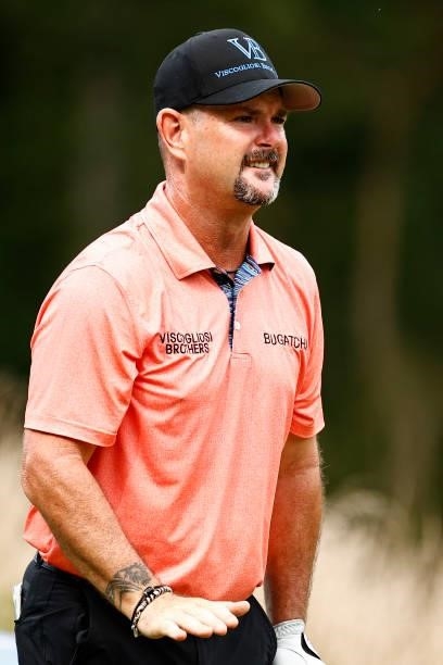 Rory Sabbatini of Slovakia reacts to his shot on the 12th tee during the third round of the Wyndham Championship at Sedgefield Country Club on August...
