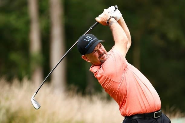 Rory Sabbatini of Slovakia plays his shot on the 12th tee during the third round of the Wyndham Championship at Sedgefield Country Club on August 14,...