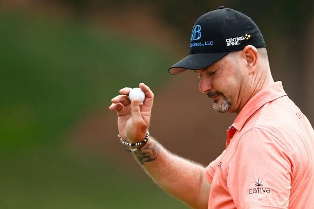 Rory Sabbatini of Slovakia waves after putting on the 18th green during the third round of the Wyndham Championship at Sedgefield Country Club on...