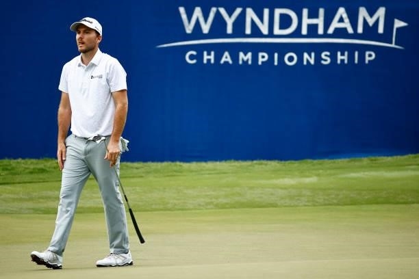 Russell Henley of the United States walks off the 18th green during the third round of the Wyndham Championship at Sedgefield Country Club on August...