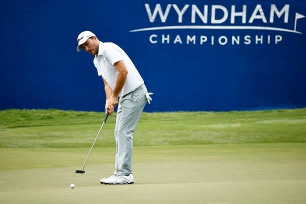 Russell Henley of the United States putts on the 18th green during the third round of the Wyndham Championship at Sedgefield Country Club on August...