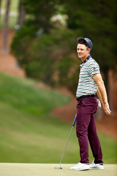 Justin Rose of England reacts to a missed putt for par on the 18th green during the third round of the Wyndham Championship at Sedgefield Country...