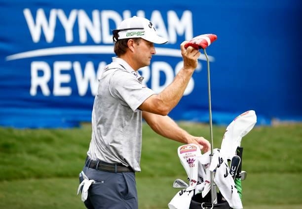 Kevin Kisner of the United States pulls his putter on the 18th green during the third round of the Wyndham Championship at Sedgefield Country Club on...