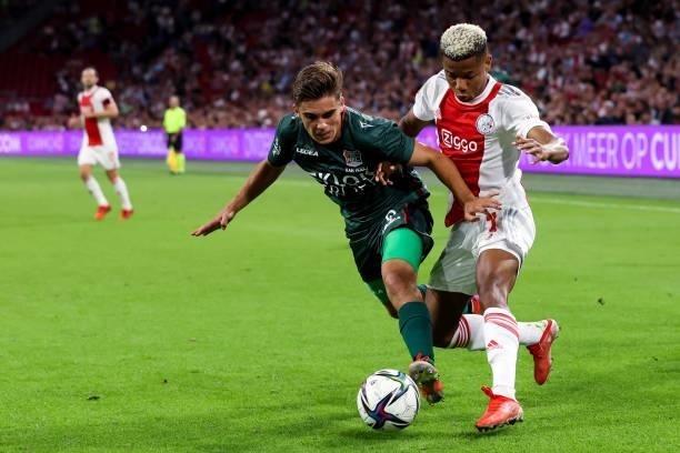 Bart van Rooij of N.E.C. And David Neres of Ajax battle for possession during the Dutch Eredivisie match between Ajax and N.E.C. At Johan Cruijff...
