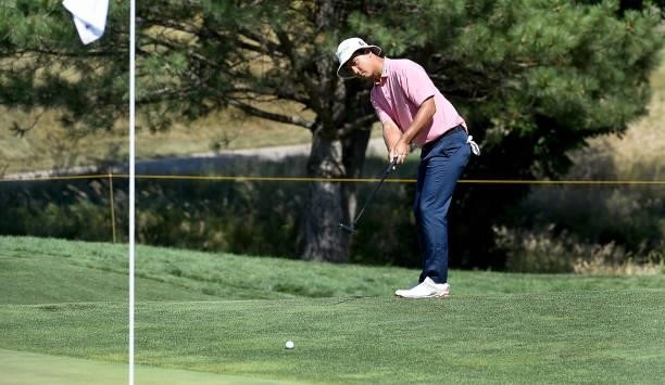 Zecheng Dou of China chips onto the green on the seventh hole during the third round of the Pinnacle Bank Championship on August 14, 2021 in Omaha,...