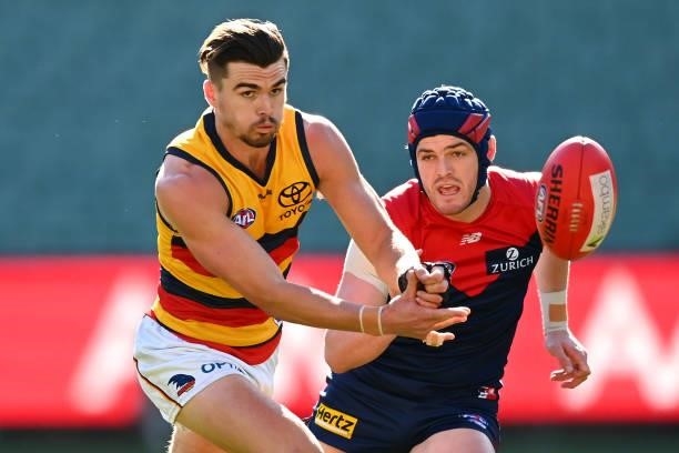 Ben Keays of the Crows handballs during the round 22 AFL match between Melbourne Demons and Adelaide Crows at Melbourne Cricket Ground on August 15,...
