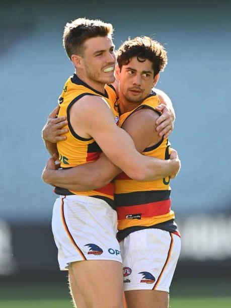 Shane McAdam of the Crows is congratulated by Paul Seedsman after kicking a goal during the round 22 AFL match between Melbourne Demons and Adelaide...