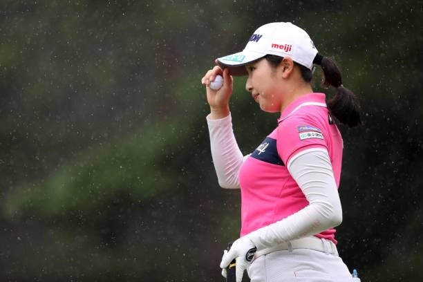 Sakura Koiwai of Japan acknowledges fans after the birdie on the 14th green during the final round of the NEC Karuizawa 72 Golf Tournament at...