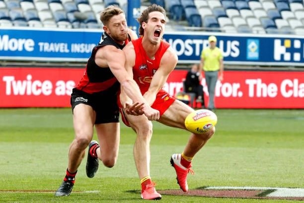 Jayden Laverde of Bombers spoils Ben King of the Suns during the round 22 AFL match between Gold Coast Suns and Essendon Bombers at GMHBA Stadium on...