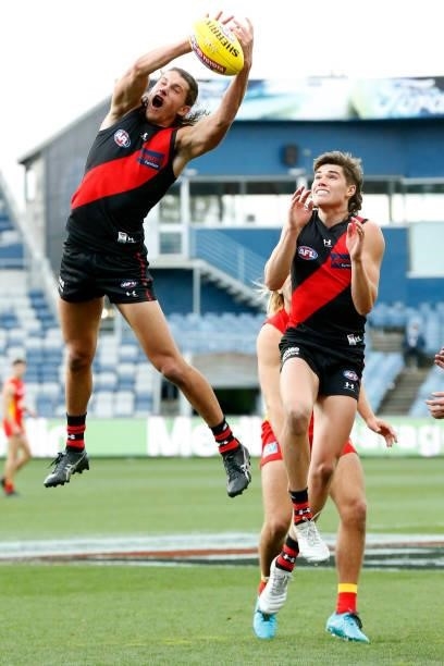 Archie Perkins of the Bombers attempts to mark the ball during the round 22 AFL match between Gold Coast Suns and Essendon Bombers at GMHBA Stadium...