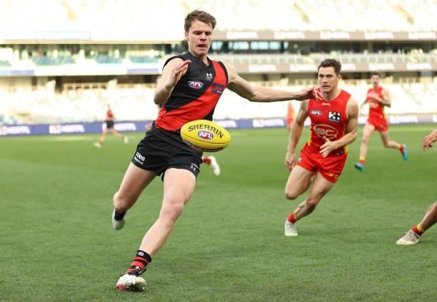 Jordan Ridley of the Bombers kicks the ball during the round 22 AFL match between Gold Coast Suns and Essendon Bombers at GMHBA Stadium on August 15,...