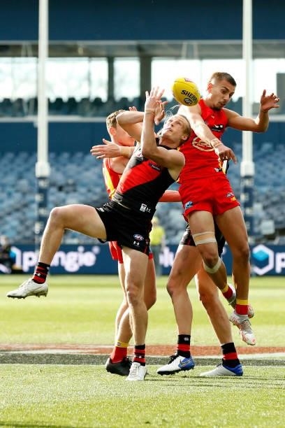 Mason Redman of the Bombers attempts to mark the ball during the round 22 AFL match between Gold Coast Suns and Essendon Bombers at GMHBA Stadium on...