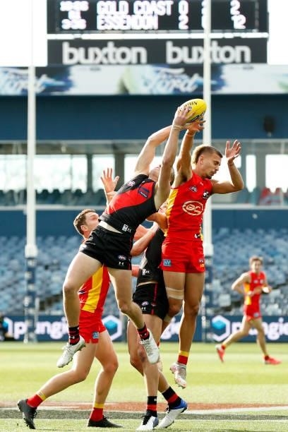 Mason Redman of the Bombers attempts to mark the ball during the round 22 AFL match between Gold Coast Suns and Essendon Bombers at GMHBA Stadium on...