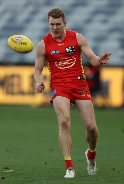 Jacob Townsend of the Suns kicks the ball during the round 22 AFL match between Gold Coast Suns and Essendon Bombers at GMHBA Stadium on August 15,...