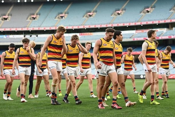 The Crows look dejected after losing the round 22 AFL match between Melbourne Demons and Adelaide Crows at Melbourne Cricket Ground on August 15,...