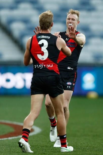Nick Hind of the Bombers celebrates a goal during the round 22 AFL match between Gold Coast Suns and Essendon Bombers at GMHBA Stadium on August 15,...