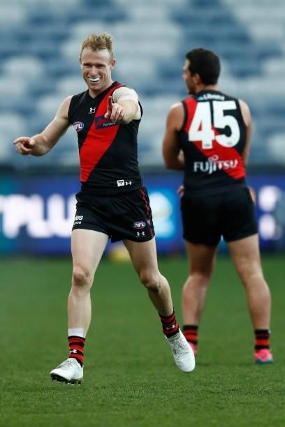 Nick Hind of the Bombers celebrates a goal during the round 22 AFL match between Gold Coast Suns and Essendon Bombers at GMHBA Stadium on August 15,...