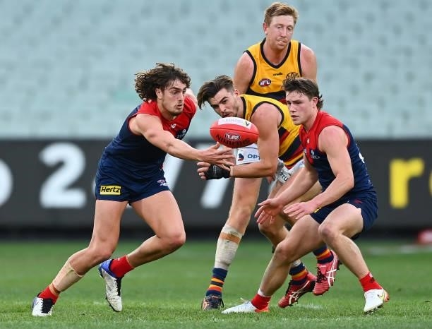 Luke Jackson of the Demons gathers the ball during the round 22 AFL match between Melbourne Demons and Adelaide Crows at Melbourne Cricket Ground on...
