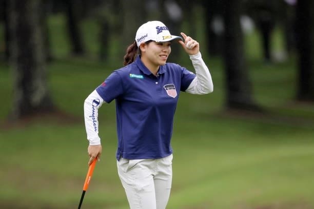 Minami Katsu of Japan acknowledges fans after holing out on the 18th green during the final round of the NEC Karuizawa 72 Golf Tournament at...