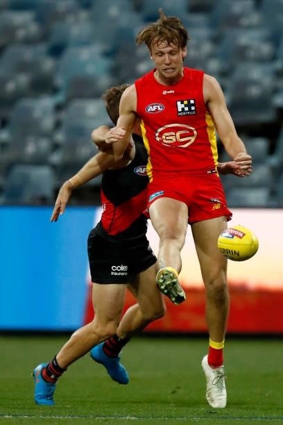 Jack Lukosius of the Suns kicks the ball during the round 22 AFL match between Gold Coast Suns and Essendon Bombers at GMHBA Stadium on August 15,...