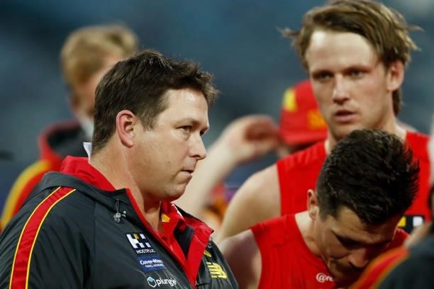 Stuart Dew, senior coach of the Suns speaks to his players during the round 22 AFL match between Gold Coast Suns and Essendon Bombers at GMHBA...