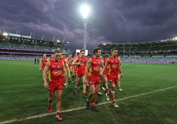 The Suns walk off after they were defeated by the Bombers during the round 22 AFL match between Gold Coast Suns and Essendon Bombers at GMHBA Stadium...