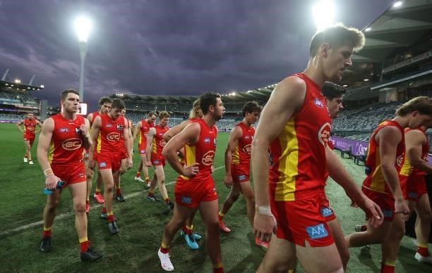 The Suns walk off after they were defeated by the Bombers during the round 22 AFL match between Gold Coast Suns and Essendon Bombers at GMHBA Stadium...