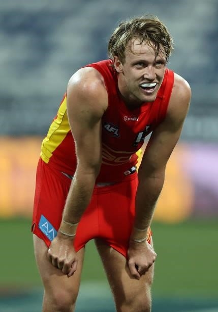 Jack Lukosius of the Suns reacts after the Suns were defeated by the Bombers during the round 22 AFL match between Gold Coast Suns and Essendon...