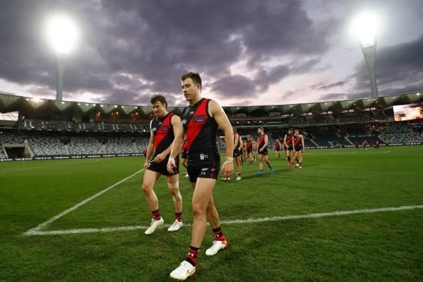 Essendon player celebrate their win after the round 22 AFL match between Gold Coast Suns and Essendon Bombers at GMHBA Stadium on August 15, 2021 in...