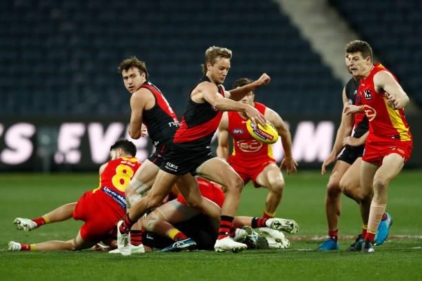 Darcy Parish of the Bombers kicks the ball during the round 22 AFL match between Gold Coast Suns and Essendon Bombers at GMHBA Stadium on August 15,...