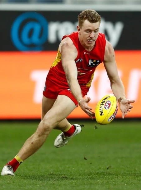 Jacob Townsend of the Suns gathers the ball during the round 22 AFL match between Gold Coast Suns and Essendon Bombers at GMHBA Stadium on August 15,...