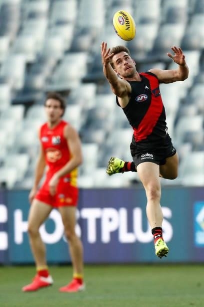 Will Snelling of the Bombers marks the ball during the round 22 AFL match between Gold Coast Suns and Essendon Bombers at GMHBA Stadium on August 15,...