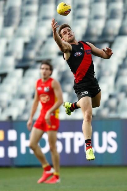 Will Snelling of the Bombers marks the ball during the round 22 AFL match between Gold Coast Suns and Essendon Bombers at GMHBA Stadium on August 15,...