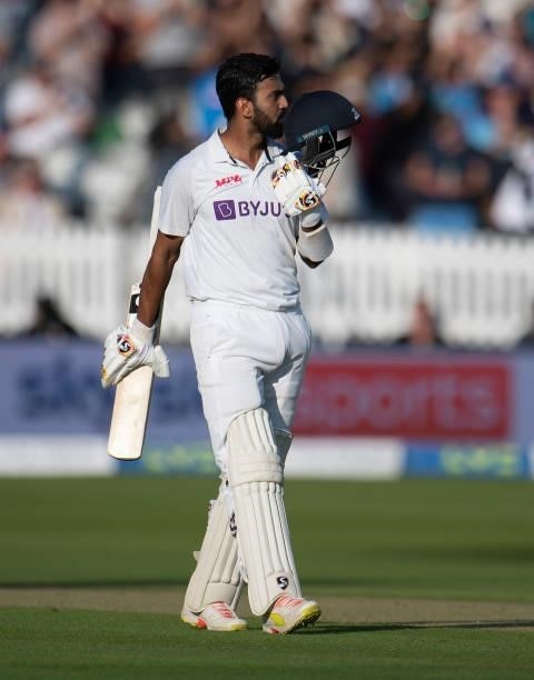 Rahul of India celebrates his century by kissing the India badge on his batting helmet during day one of the Second LV= Insurance Test Match between...