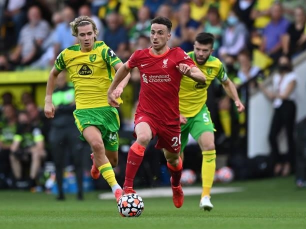 Dioga Jota of Liverpool runs with the ball during the Premier League match between Norwich City and Liverpool at Carrow Road on August 14, 2021 in...