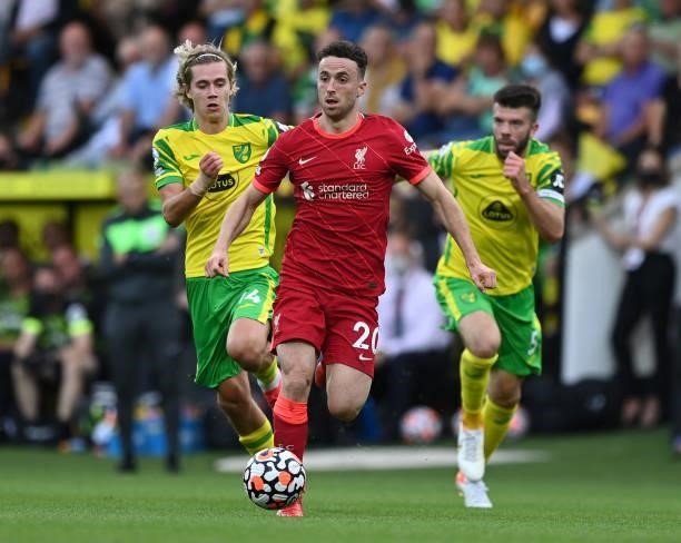 Dioga Jota of Liverpool runs with the ball during the Premier League match between Norwich City and Liverpool at Carrow Road on August 14, 2021 in...