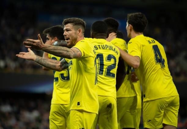Alberto Moreno of Villarreal CF encourages the fans after their goal during the UEFA Super Cup between Chelsea and Villarreal CF at Windsor Park on...