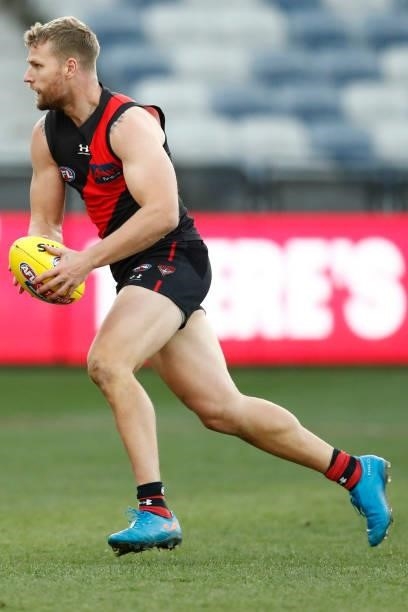 Jake Stringer of the Bombers runs with the ball during the round 22 AFL match between Gold Coast Suns and Essendon Bombers at GMHBA Stadium on August...