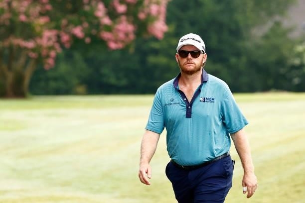 Harry Higgs of the United States walks the first hole during the final round of the Wyndham Championship at Sedgefield Country Club on August 15,...