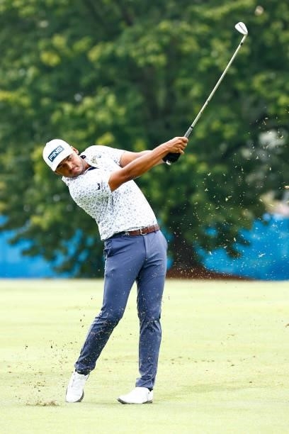 Sebastian Munoz of Colombia plays an approach shot on the first fairway during the final round of the Wyndham Championship at Sedgefield Country Club...